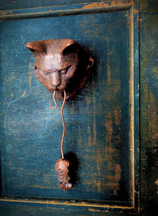 Kitty and Her Prize Door Knocker